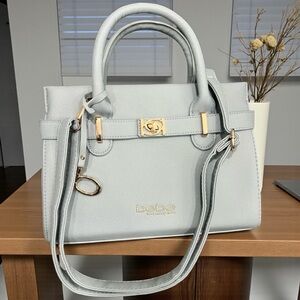 NWOT Bebe Soft Blue Handbag with Gold Accents and Hardware